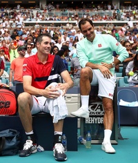 Roger Federer and John Isner